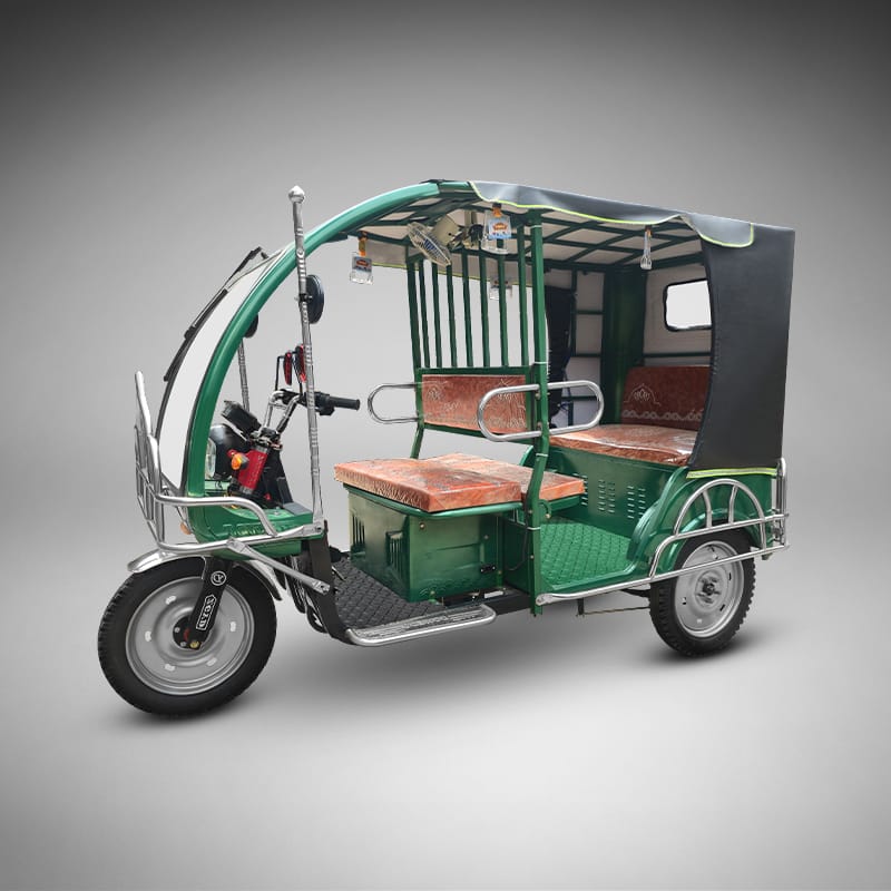 Complete side view of the green Borak auto rickshaw.